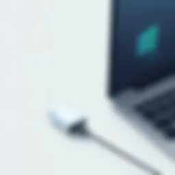 A sleek portable charger connected to a laptop