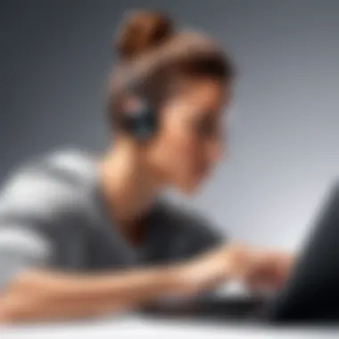 Professional using wireless earbuds while working on a laptop, emphasizing productivity